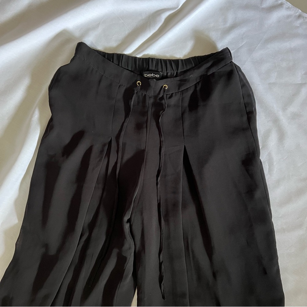 Bebe LINED WITH SHEER OVERLAY PANT• black • size XS• front pleating & drawstring